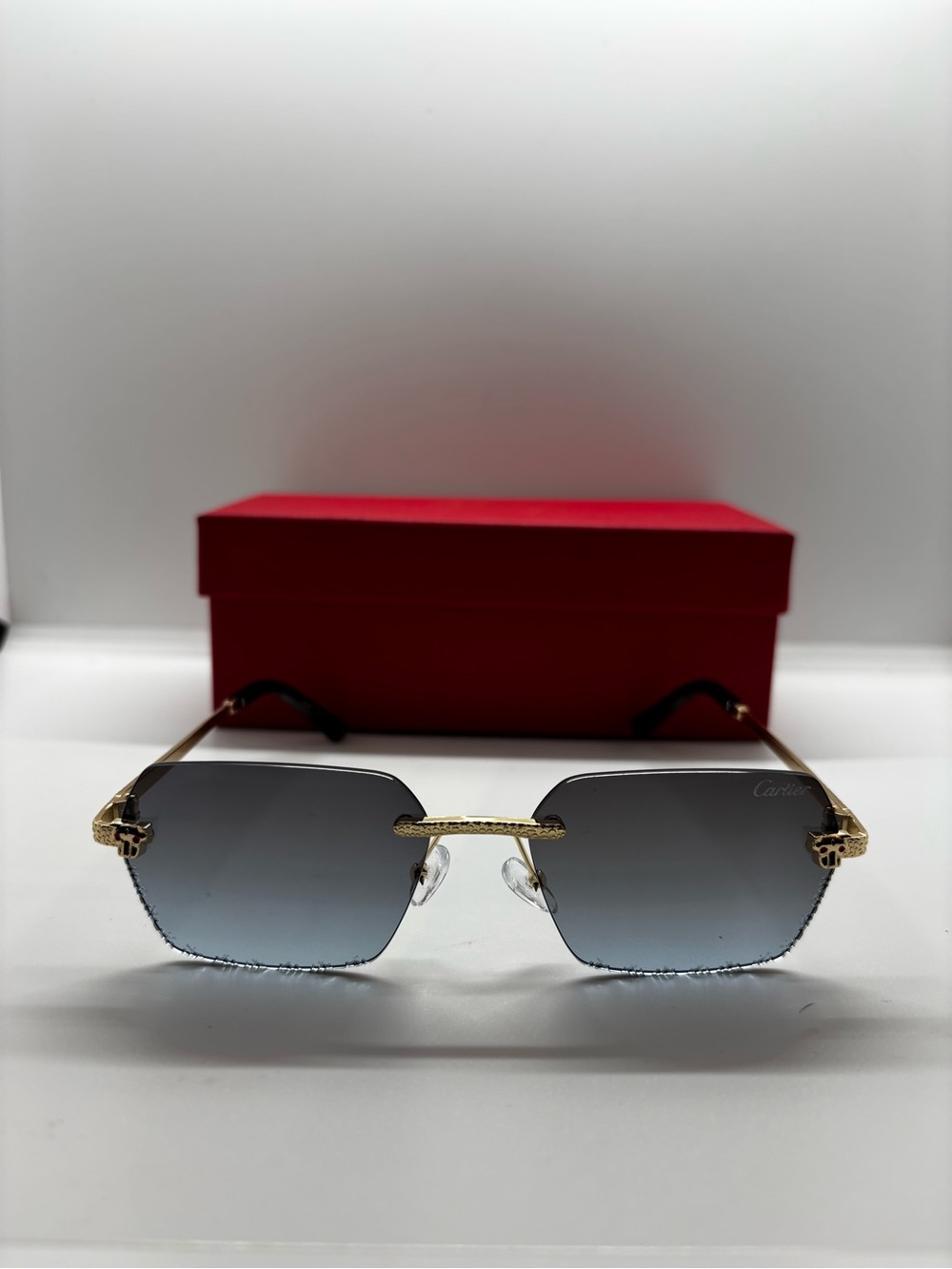 Gold-Trim Rimless Sunglasses with Light Gray Gradient Lenses